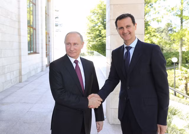 Hai nhà lãnh đạo Nga - Syria tại cuộc gặp ngày 17-5. Ảnh: TASS