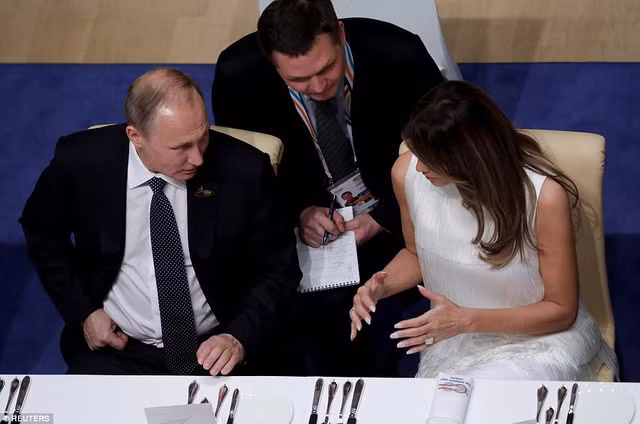 Tổng thống Putin cùng Đệ nhất phu nhân Melania Trump. Ảnh: Reuters