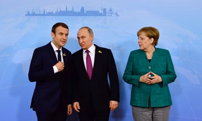 Tổng thống Nga Vladimir Putin cùng Tổng thống Pháp Emmanuel Macron và Thủ tướng Đức Angela Merkel tại một cuộc gặp. Ảnh: TNN