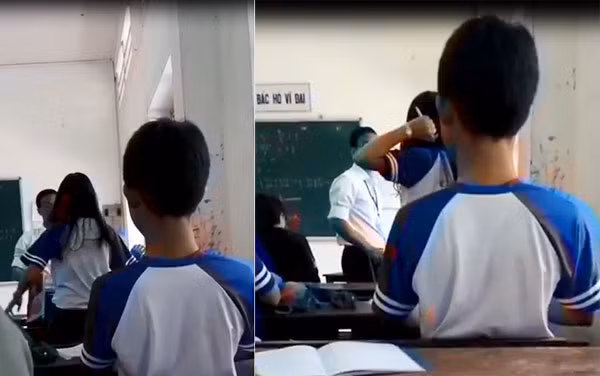 Ảnh cắt từ video ghi lại cảnh thầy giáo và nữ sinh đánh nhau trong lớp học.
