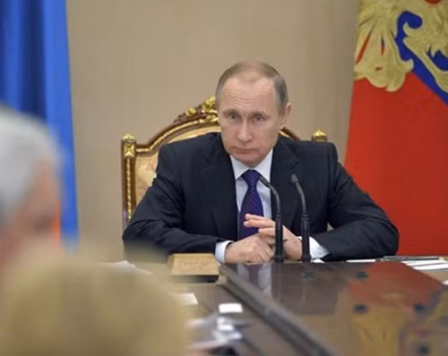 Tham dự phiên họp của Hội đồng chống tham nhũng quốc gia hôm 26-1, Tổng thống Nga Vladimir Putin tuyên bố từng bước trị nạn tham nhũng. Ảnh: Reuters.