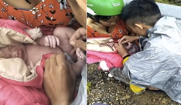 Hình ảnh anh Xiêng đỡ đẻ cho vợ ngay bên lề đường.