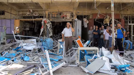 Hiện trường một vụ đánh bom ở Baghdad, ngày 19/7/2014. Hiện trường một vụ đánh bom ở Baghdad, ngày 19/7/2014.