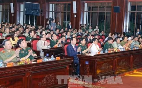 Chủ tịch nước Trần Đại Quang cùng các đại biểu dự chương trình (Ảnh TTXVN).