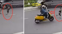 Để con nhỏ sang đường va vào xe điện, ông bố giở thói côn đồ đánh người