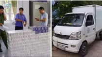 Kiểm tra xe tải nữ tài xế cầm lái, "lòi" ra hàng ngàn bao thuốc lá lậu