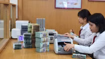 Lãi suất huy động hạ, tiền gửi vào ngân hàng giảm