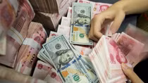 Vì sao Nhân dân tệ tăng giá so với USD?