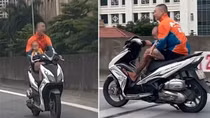 Nam thanh niên bế em bé, chạy xe máy lên đường Vành đai 3 trên cao