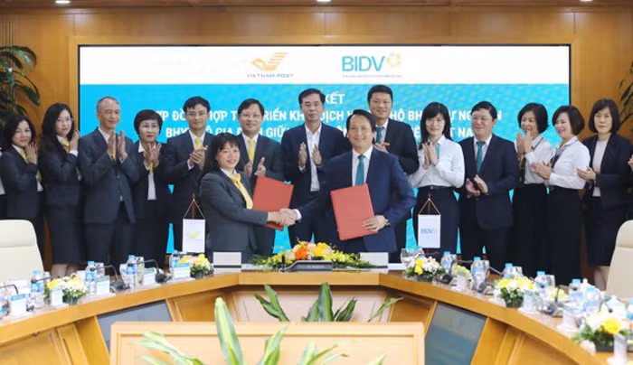 BIDV và Vietnam Post hợp tác triển khai dịch vụ thu hộ bảo hiểm -0