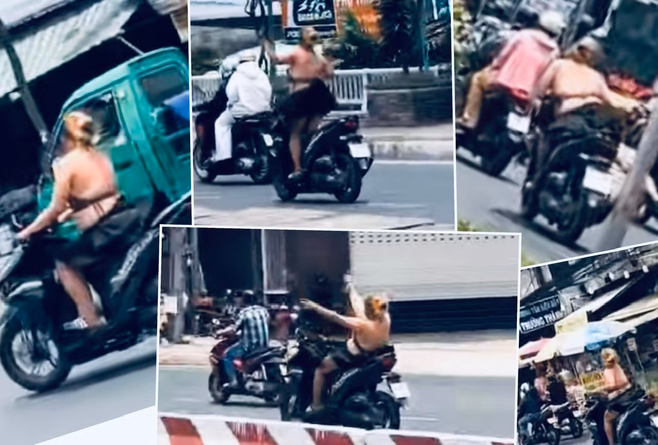 Nữ “quái xế” với biểu hiện bất thường ăn mặc hở hang “làm xiếc” khi đang chạy xe máy -0