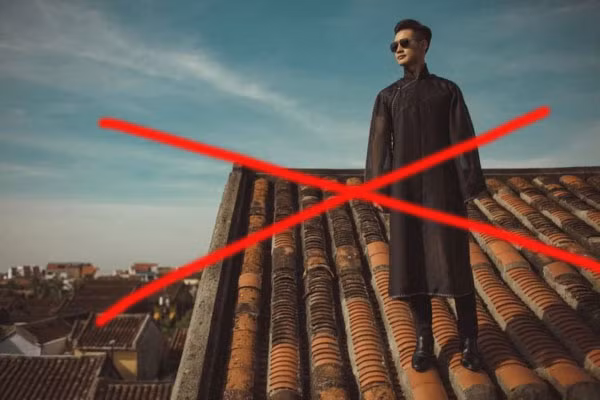 Xử nghiêm ca sĩ ngồi trên mái nhà phố cổ Hội An chụp ảnh phản cảm -1