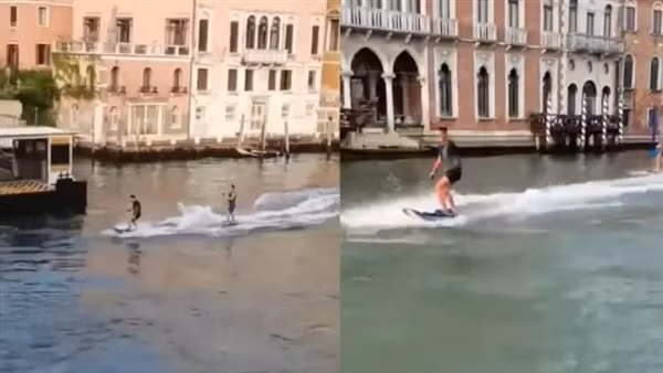 Thản nhiên lướt sóng ở Venice để quay clip, hai du khách được mời ra toà