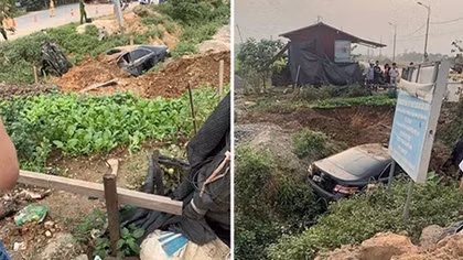 Tài xế máy múc cứu 3 người trong ô tô Camry mất lái lao xuống rìa đường bốc cháy
