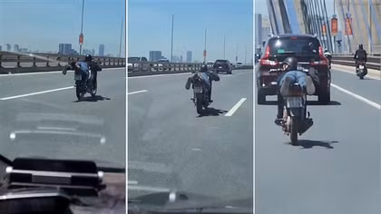 Nam thanh nằm rạp trên yên xe, vít ga trên cầu Nhật Tân