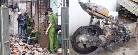 Các điều tra viên đang khám xét hiện trường vụ việc do Đỗ Đình Nam gây nên cùng chiếc xe máy bị cháy trơ khung tại hiện trường vụ án ngày 2/6/2014.