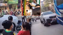 Ô tô SUV kéo lê xe máy SH trên phố Khâm Thiên