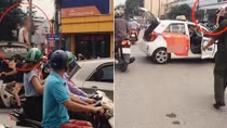 Tài xế taxi leo lên nóc xe "ăn vạ" CSGT