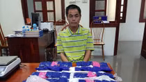 Bắt xe khách lên Điện Biên mua 1 bánh heroin và 14 nghìn viên ma túy 