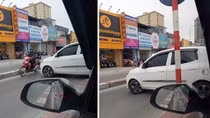 Kia Morning hồn nhiên quay đầu trên cầu vượt Lê Văn Lương
