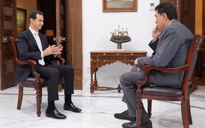 Tổng thống Assad trả lời phỏng vấn. Ảnh: Ekathimerini
