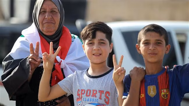 Người dân Mosul mừng quê hương được giải phóng. Ảnh: Press TV