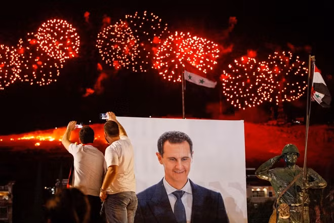 Tỷ lệ cử tri đi bỏ phiếu và số phiếu ủng hộ ông al-Assad trong cuộc bầu cử Tổng thống Syria hồi tháng 5 vừa qua tăng đáng kể so với năm 2014. (Ảnh: Reuters)