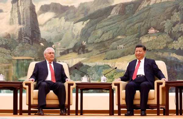 Ngoại trưởng Mỹ (trái) và Chủ tịch Trung Quốc tại cuộc gặp ngày 19-3. Ảnh: Reuters