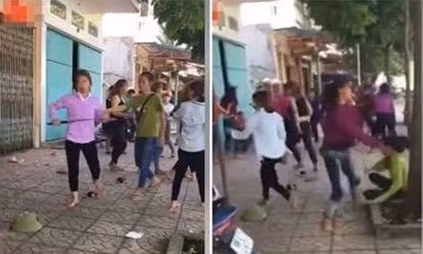 Một số cô gái trẻ sử dụng “vũ khí nóng” hỗn chiến Trung tâm Giáo dục thường xuyên huyện Vĩnh Tường. (Ảnh: Cắt từ clip)