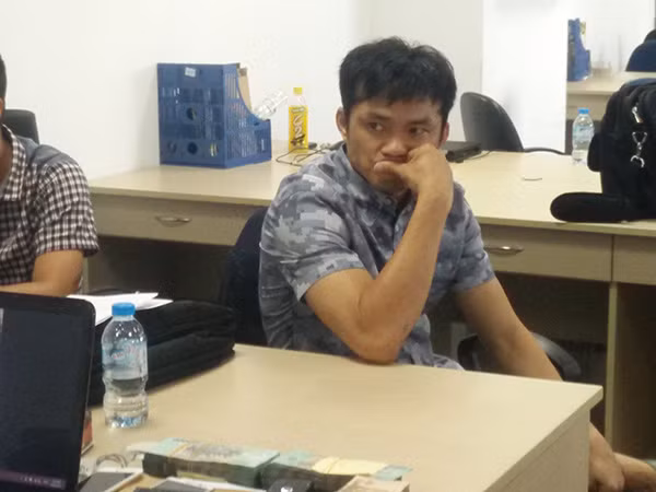 Nguyễn Văn Kì Chủng tại buổi khám xét.