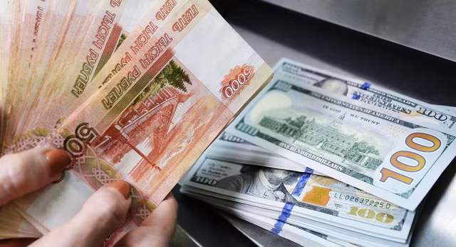 Nga sẽ sơm thay USD bằng một đồng tiền mới trong các giao dịch quốc tế. Ảnh: Reuters.