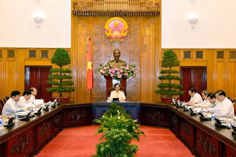 Thủ tướng Chính phủ Nguyễn Tấn Dũng chủ trì cuộc họp với các Ban, Bộ ngành, cơ quan liên quan về việc đồng Nhân dân tệ của Trung Quốc giảm giá. Ảnh: VGP/Nhật Bắc