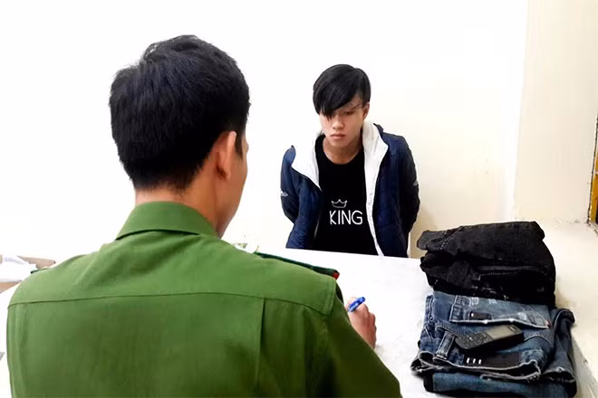 Đối tượng Nguyễn Quang Dũng tại cơ quan điều tra.