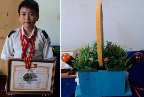 Em Nguyễn Duy Long nhận Bằng khen mô hình đèn bắt côn trùng.