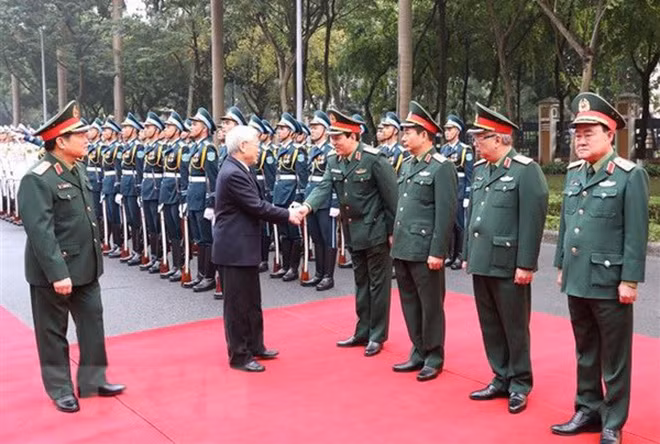 Tổng Bí thư, Chủ tịch nước Nguyễn Phú Trọng, Bí thư Quân ủy Trung ương với các lãnh đạo Bộ Quốc phòng. (Ảnh: Trí Dũng/TTXVN)
