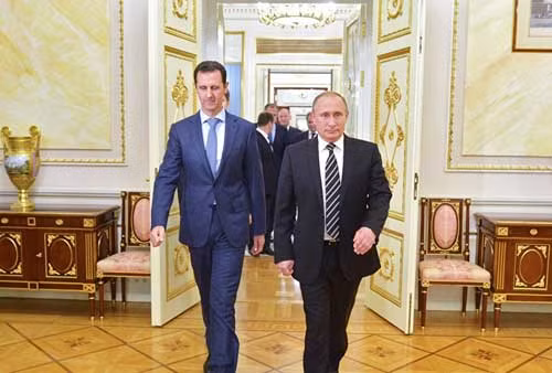 Tổng thống Putin (phải) và người đồng cấp Syria Assad.