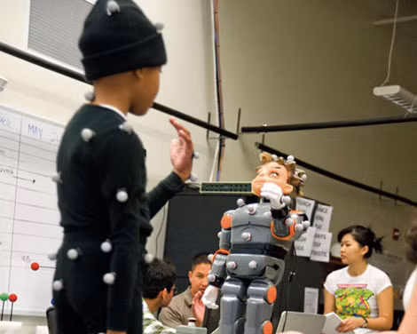 Robot Zeno tương tác với trẻ tự kỷ. Robot Zeno tương tác với trẻ tự kỷ.
