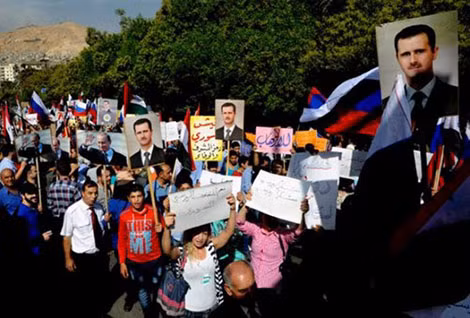 Người dân Syria ủng hộ Tổng thống Syria Bashar Assad. Ảnh: PressTV.
