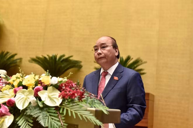Thủ tướng Chính phủ Nguyễn Xuân Phúc trình bày Báo cáo tại phiên khai mạc Kỳ họp thứ 10.