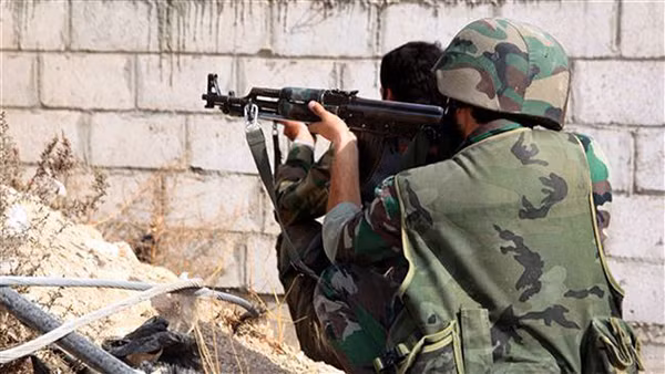 Quân đội Syria tổ chức trận đánh ở ngoại ô Damascus. Ảnh SANA.