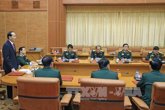 Chủ tịch nước Trần Đại Quang làm việc với Lãnh đạo Bộ Quốc phòng. Ảnh: Nhan Sáng-TTXVN.