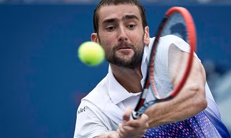 ĐKVĐ Marin Cilic vượt qua Tsonga sau 5 set đấu để tiếp tục hành trình bảo vệ ngôi vô địch. (Ảnh usopen.org).