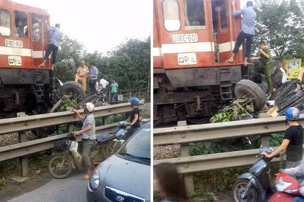 Xe tải bị tàu hỏa vò nát. Ảnh: N.N.Mai Xe tải bị tàu hỏa vò nát. Ảnh: N.N.Mai