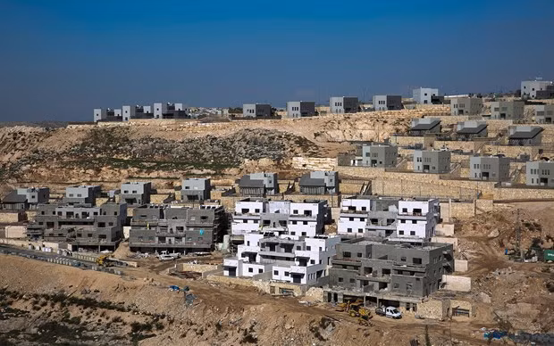 Israel tạm dừng tuyên bố chủ quyền ở các khu định cư Bờ Tây. Ảnh: AP