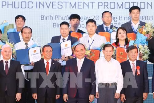 Thủ tướng Nguyễn Xuân Phúc dự Hội nghị xúc tiến đầu tư tỉnh Bình Phước năm 2018. Ảnh: Thống Nhất - TTXVN