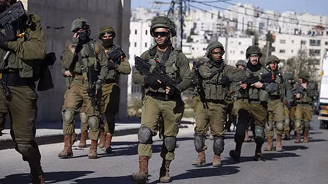 Lính Israel bảo vệ các khu định cư của người Israel ở Bờ Tây. Ảnh: CNN.