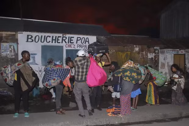 Nhiều gia đình đã chạy sang Rwanda để tị nạn. Ảnh: AP.