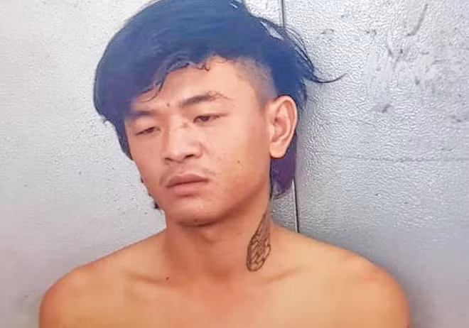 Hung thủ Nguyễn Đức Dũng sau khi đầu thú. Ảnh: CA TPNT