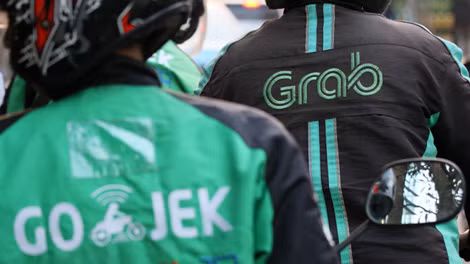 Grab và Go-Jek cạnh tranh khốc liệt tại thị trường Indonesia.