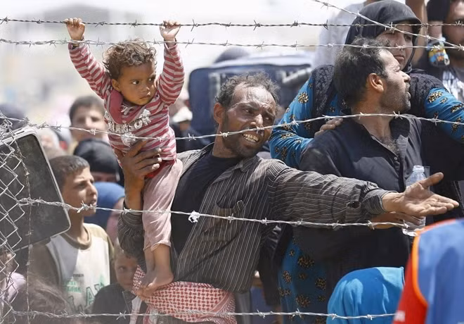 Người di cư Syria chạy trốn khỏi tình trạng bất ổn ở quê hương. Ảnh minh họa Reuters.